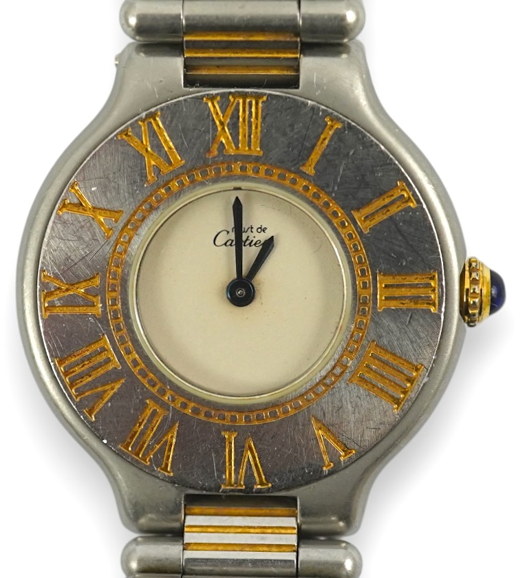 A lady's steel and gold plated Must De Cartier quartz wrist watch, on a steel and gold plated Must De Cartier bracelet